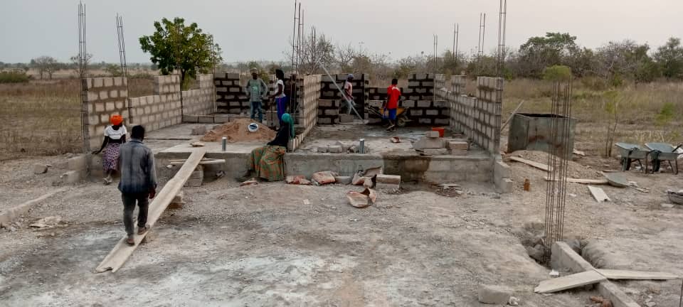 Construction team pouring foundations